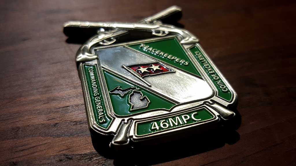 army challenge coin back image showing guns and stars