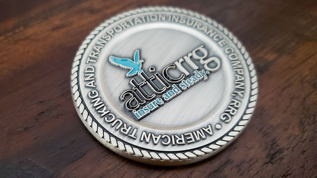 attic insurance challenge coin front