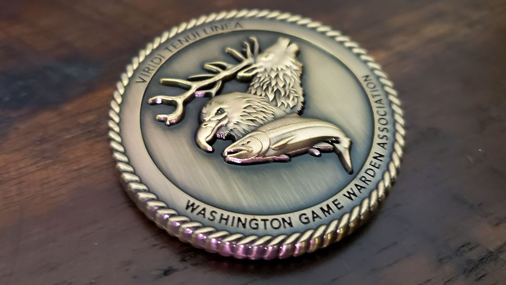 fish and wildlife officer coin back