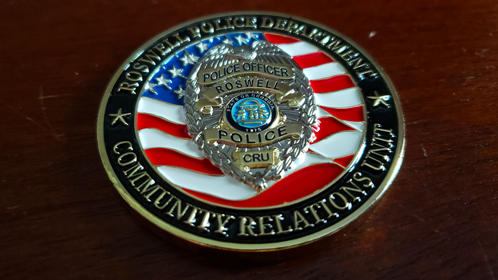 community relations unit coin front