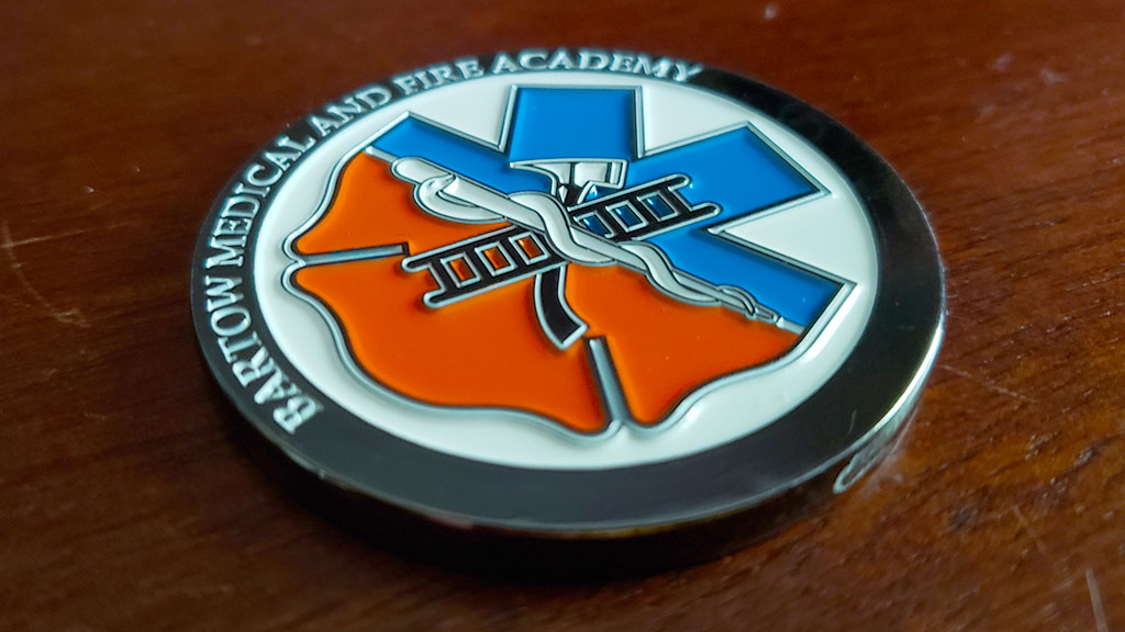 medical and fire academy coin front